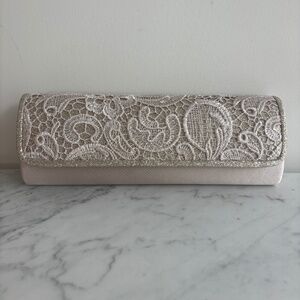 Powder-colour shiny lace clutch bag